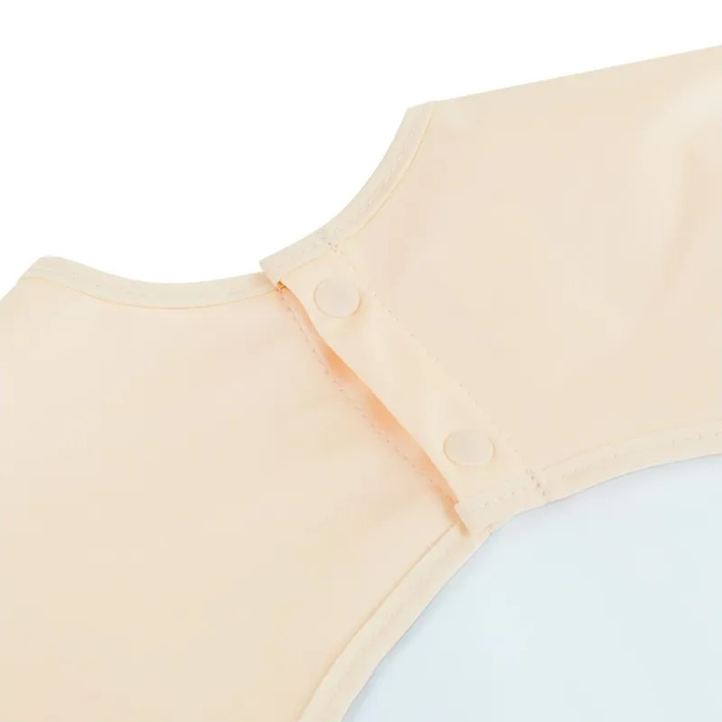 Miniland Podbradník s dlhým rukávom - Jurassic